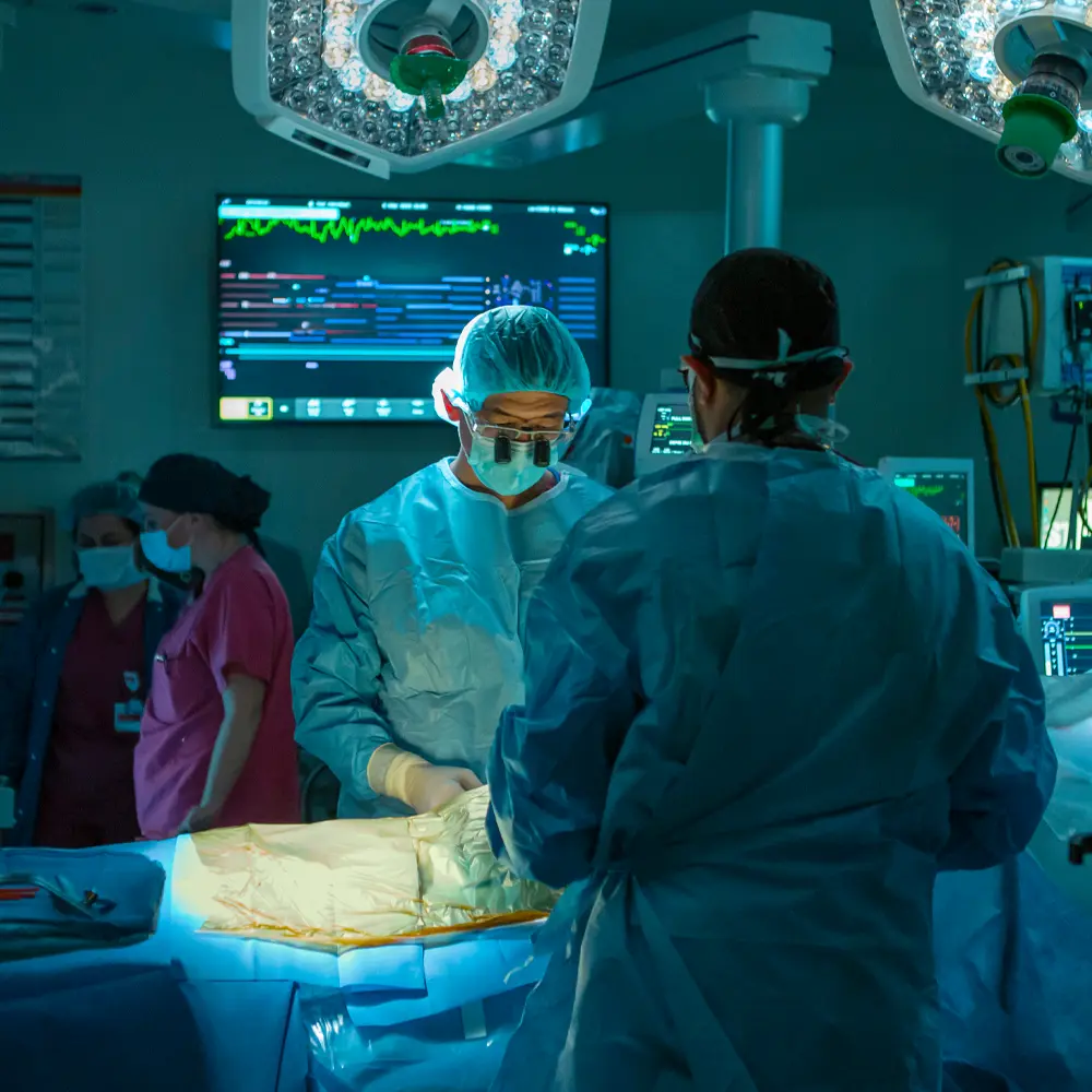 Doctors in an operating room performing surgery.