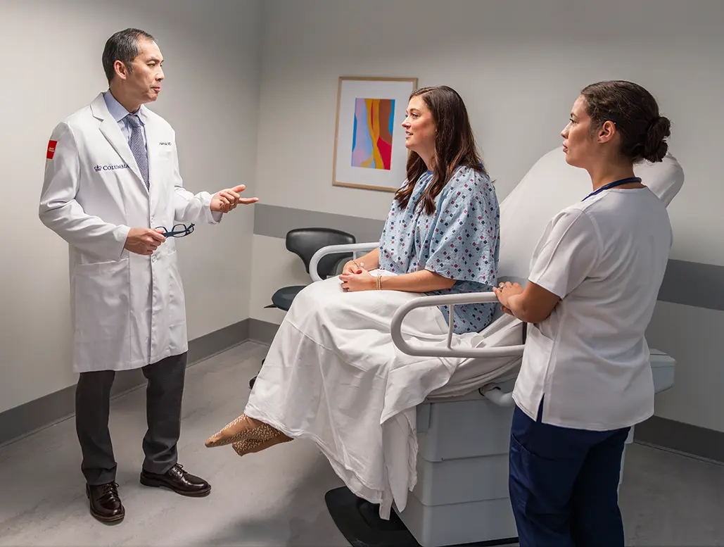 Doctor with a patient and nurse