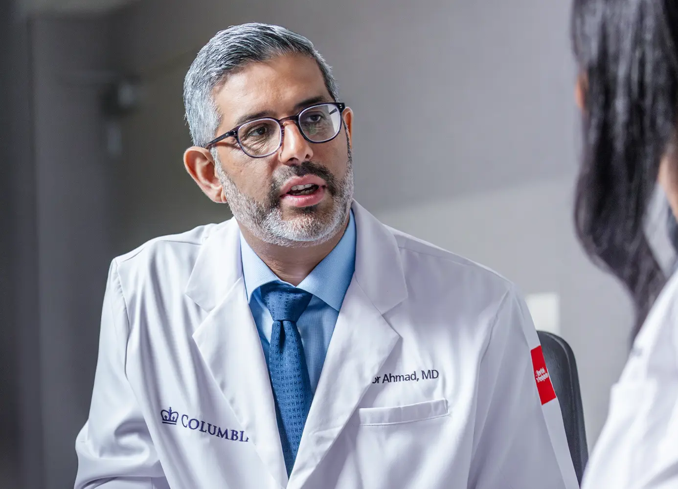 Doctor talking to another