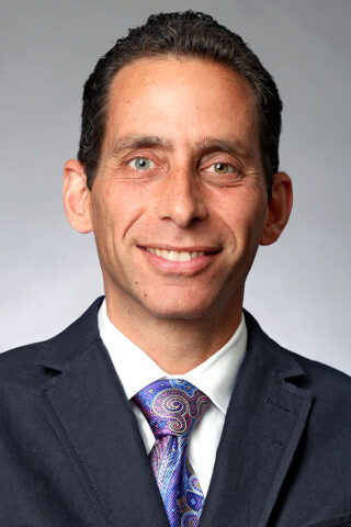 Dr. Justin K. Greisberg
