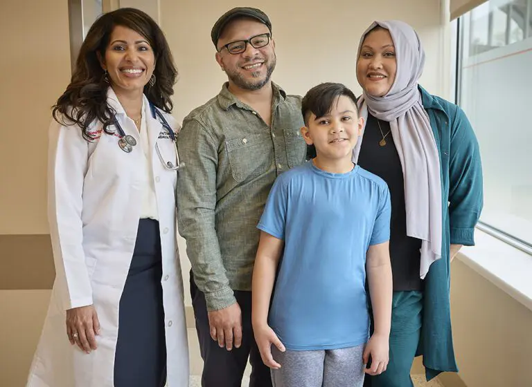 Dr. Maria Thanjan with Yasin, his father Adam and mother Syema.