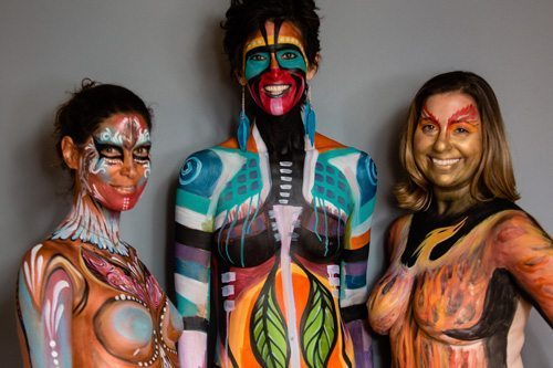  Dana Bledsoe, Marquina Iliev-Piselli, founder of the Breast Cancer Women’s Empowerment Project, and Carrie Kreiswirth in their body paint.