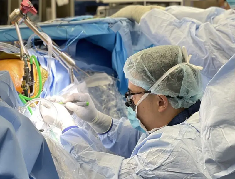 Surgeon performing lateral spine surgery on a patient