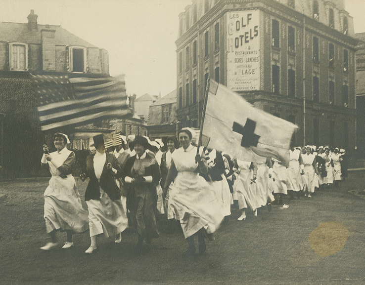 A parade of Base Hospital No. 2 nurses celebrates Anna Maxwell during her visit to Etretat, France, summer 1918.