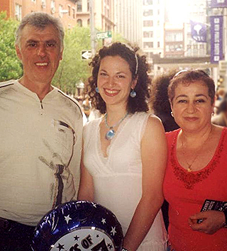 Jenny Gartshteyn, center, with her parents, Aleksandr and Faina, at her medical school graduation.