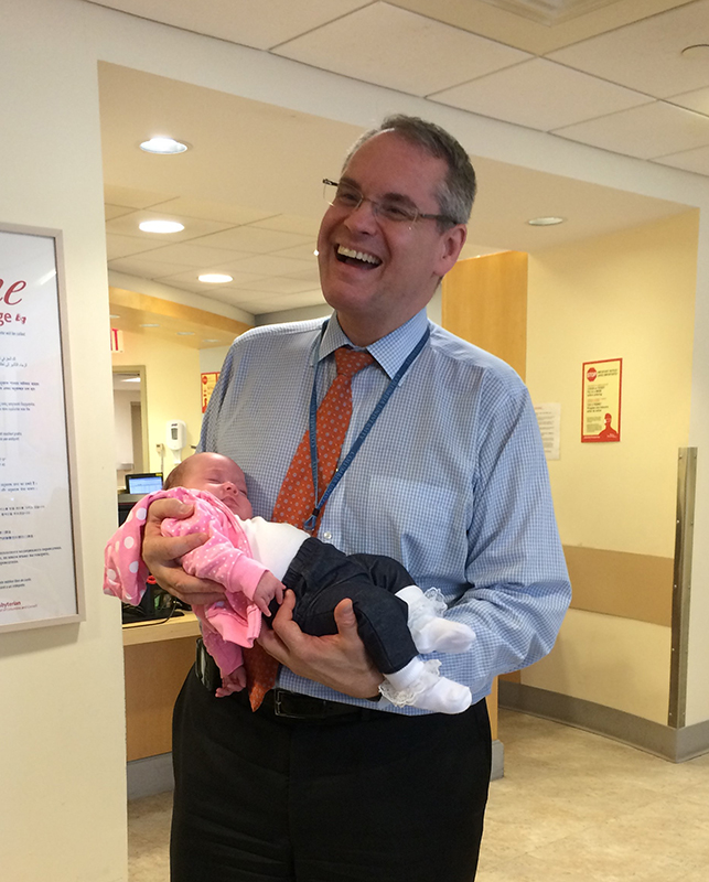 image of Dr. Jurcic holding baby Emma