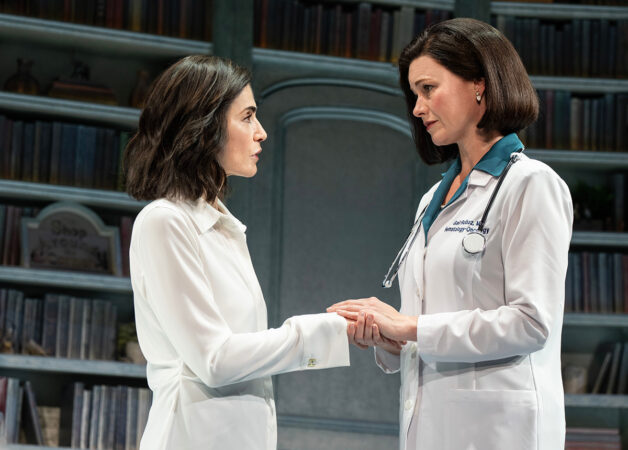 Actress Juliana Margulies (left) as Delia Ephron in a scene from "Left on Tenth," alongside Kate MacCluggage, who plays her oncologist, Dr. Gail Roboz.