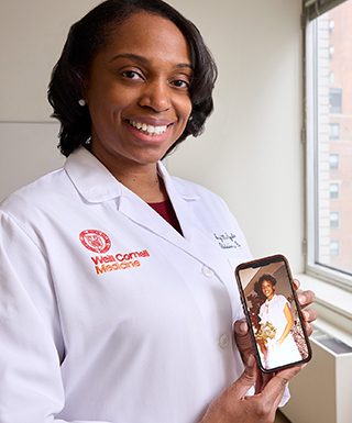 Dr. McDougale with a picture of her mother.