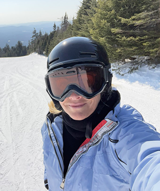 Karen on a ski slope after her surgery.