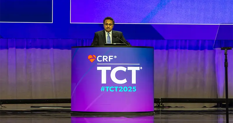 Dr. Sahil Parikh standing at TCT conference podium