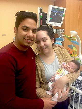 Emily and husband Eli Estrella with 2-month-old Olivia in 2016.