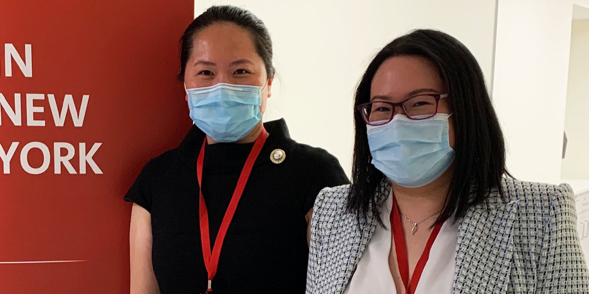 Jenny Gao, a patient services facilitator at NewYork-Presbyterian Lower Manhattan Hospital, with her colleague, patient services senior coordinator Sze Kum Tam