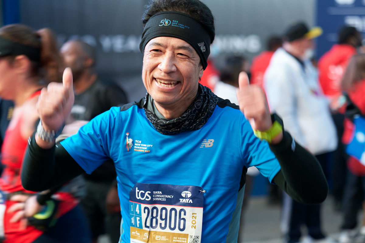 Dr. Kato celebrates finishing his eighth New York City Marathon.