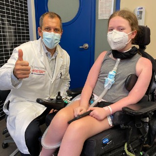 Dr. Michael G. Vitale and Greta about a week before her spinal fusion.