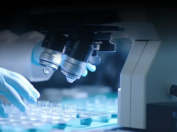 doctor looking through a microscope