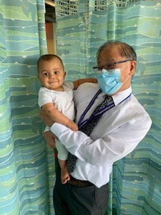 Mateo, pictured with Dr. Yamashiro, grew stronger as his tumor shrunk.