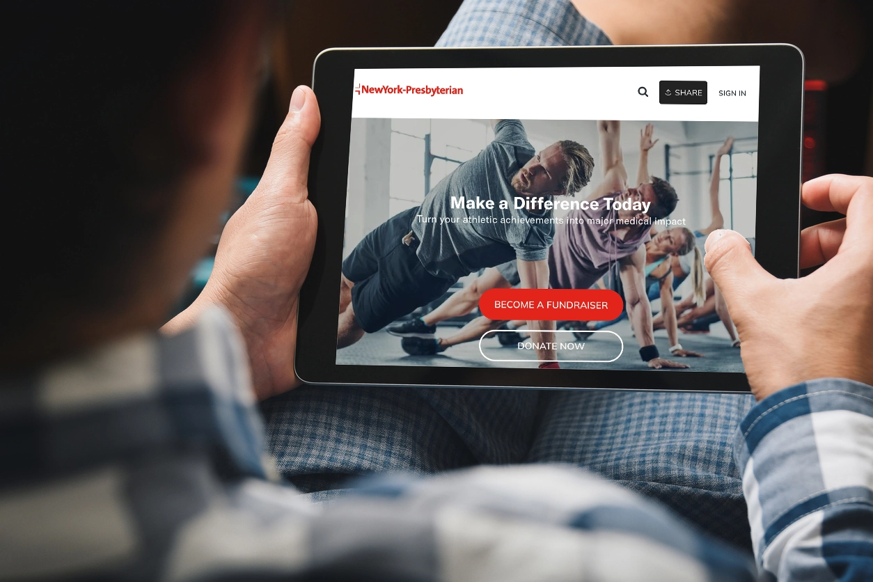 Man holding a tablet viewing a peer-to-peer site page