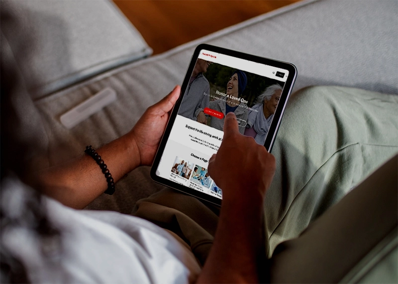 someone on a tablet beginning to start a fundraising page