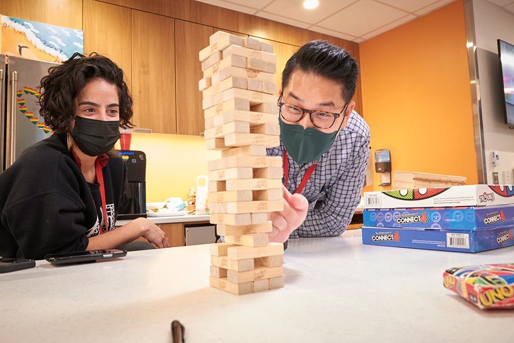 staff playing jenga