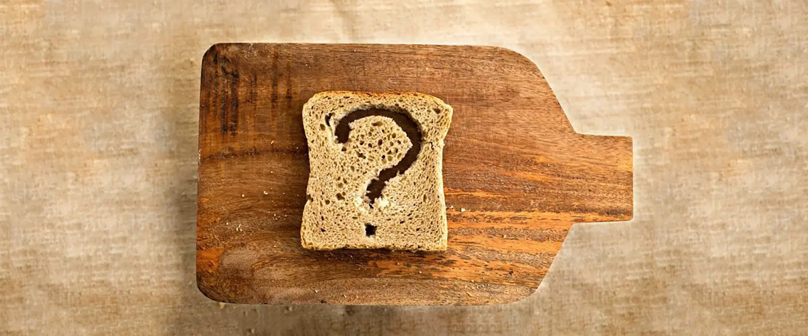 A piece of bread on a cutting board