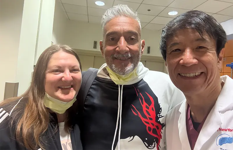 image of Chris Carrales with wife, Jessica, and Dr. Kato