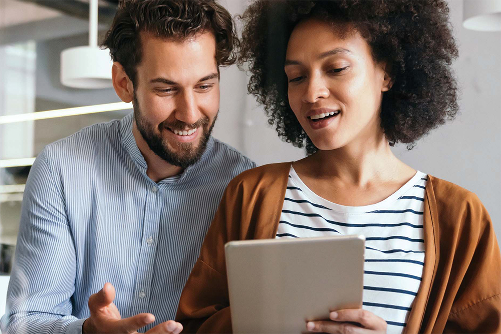 Couple looking at a tablet
