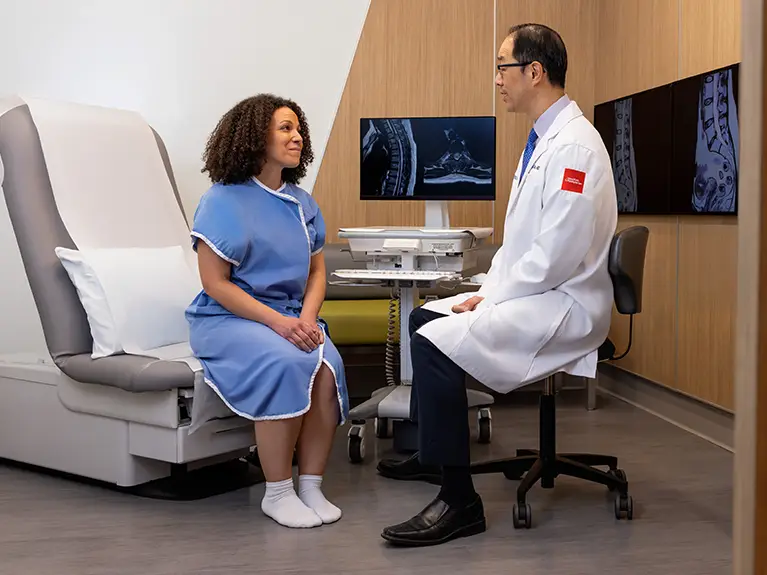 Dr. Chou speaking with a patient