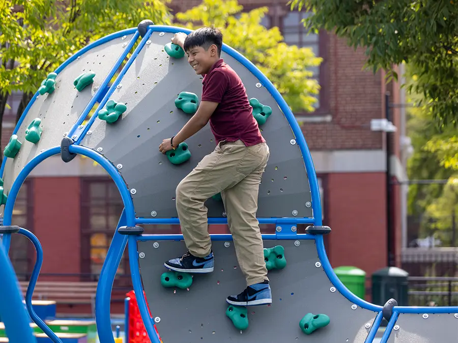 kid playing on jungle gym