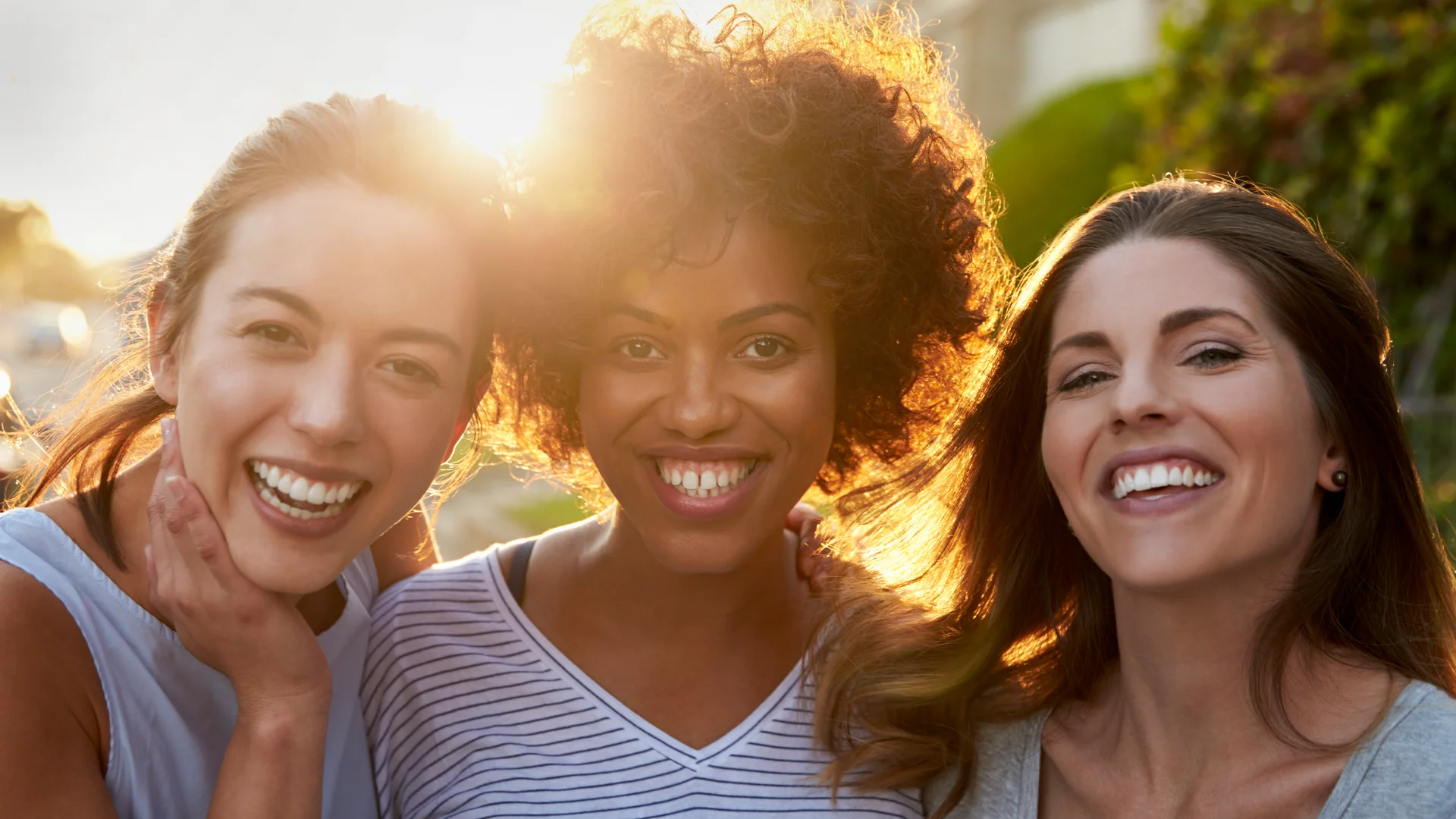 A group of young women smiling.