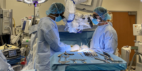 Dr. Venkat Boddapati and Dr. Zeeshan Sardar performing surgery