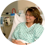 Woman lying in hospital bed