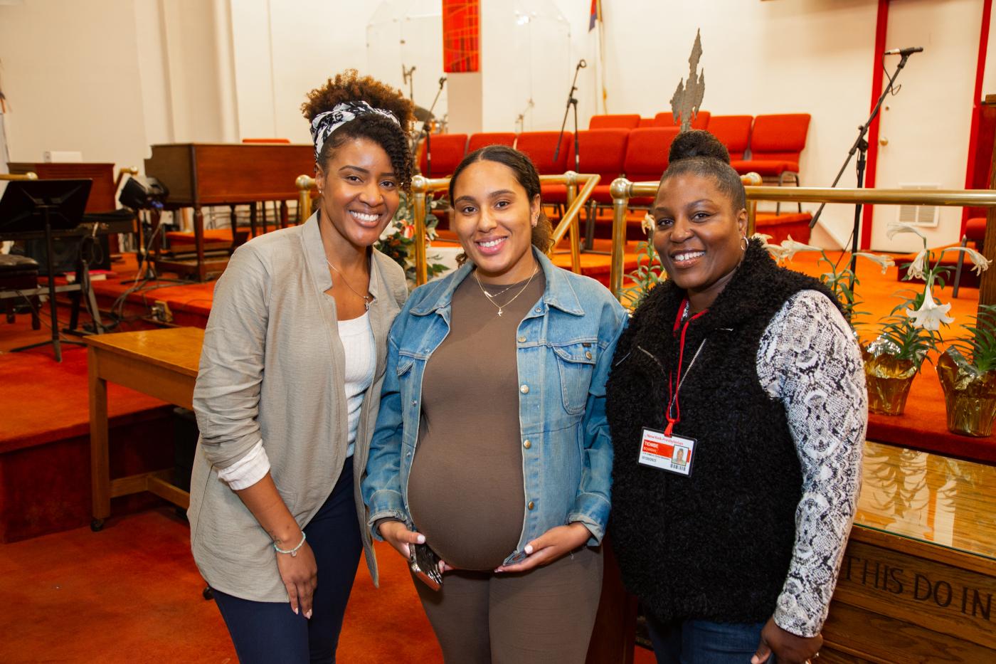 NYP staff with a patient at the 2024 HEAL'in the Community Maternal Fair