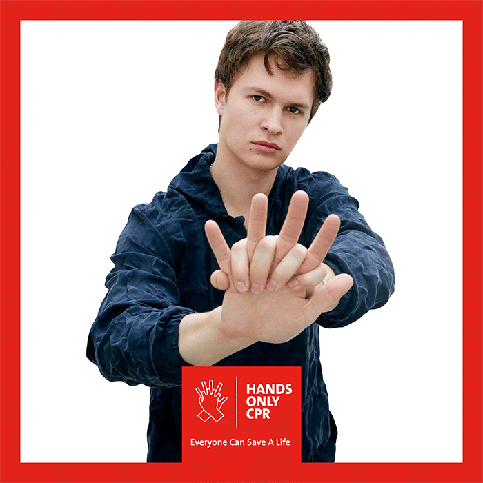 Ansel Elgort demonstrating hands-only CPR