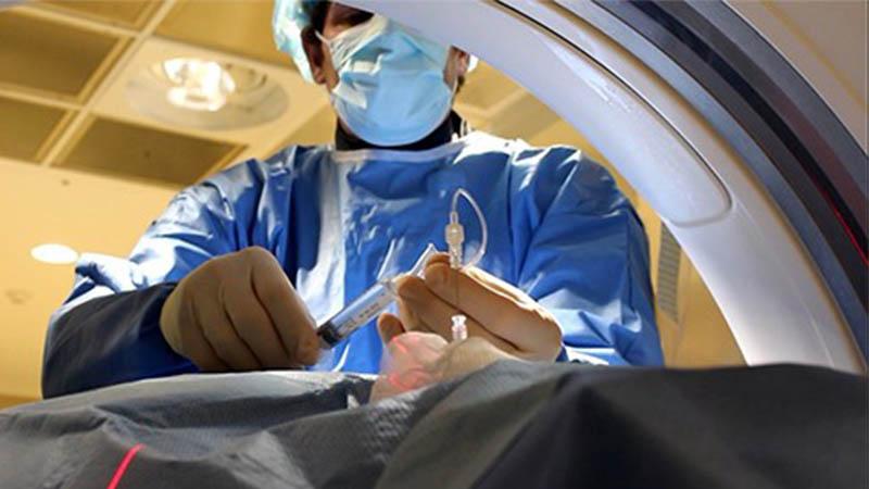 Dr. Kaplitt delivers gene therapy to a patient with Parkinson’s disease.